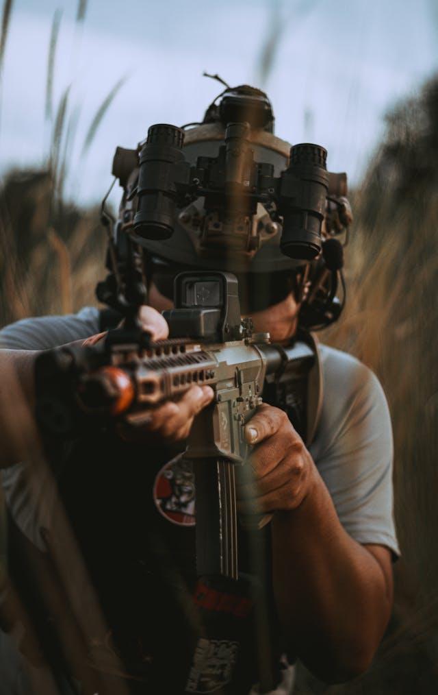 Man aiming down with his rile