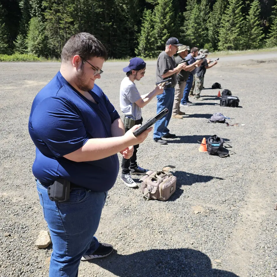 Men lined up in the shooting range
