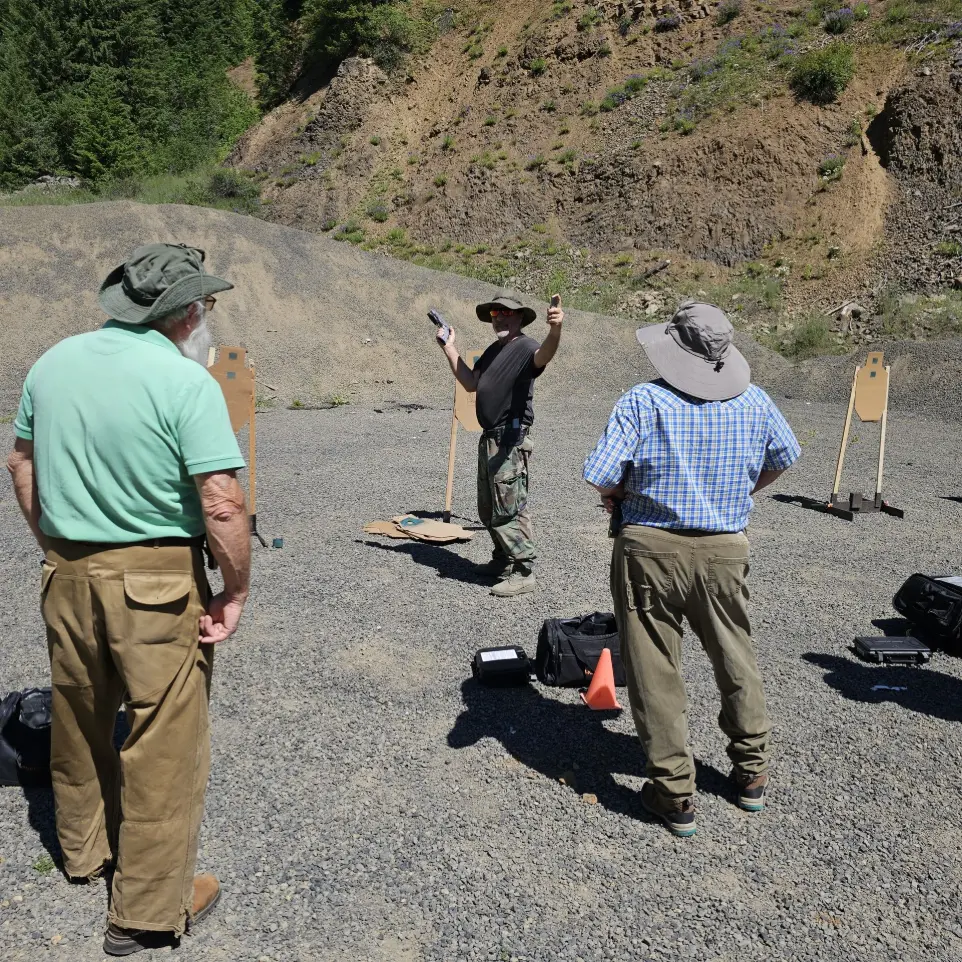 Men listening to the gun instructor