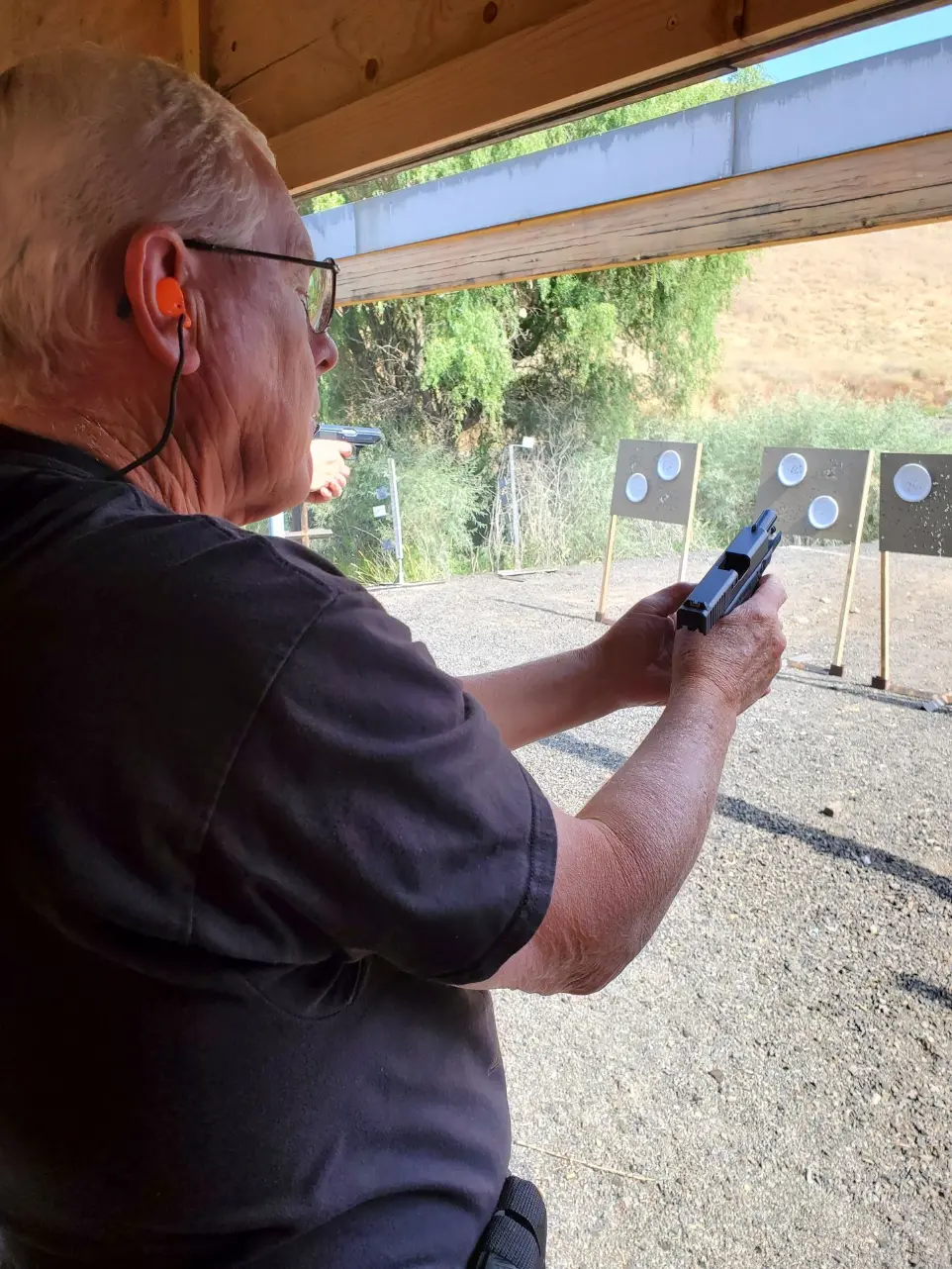 Man aiming firearm