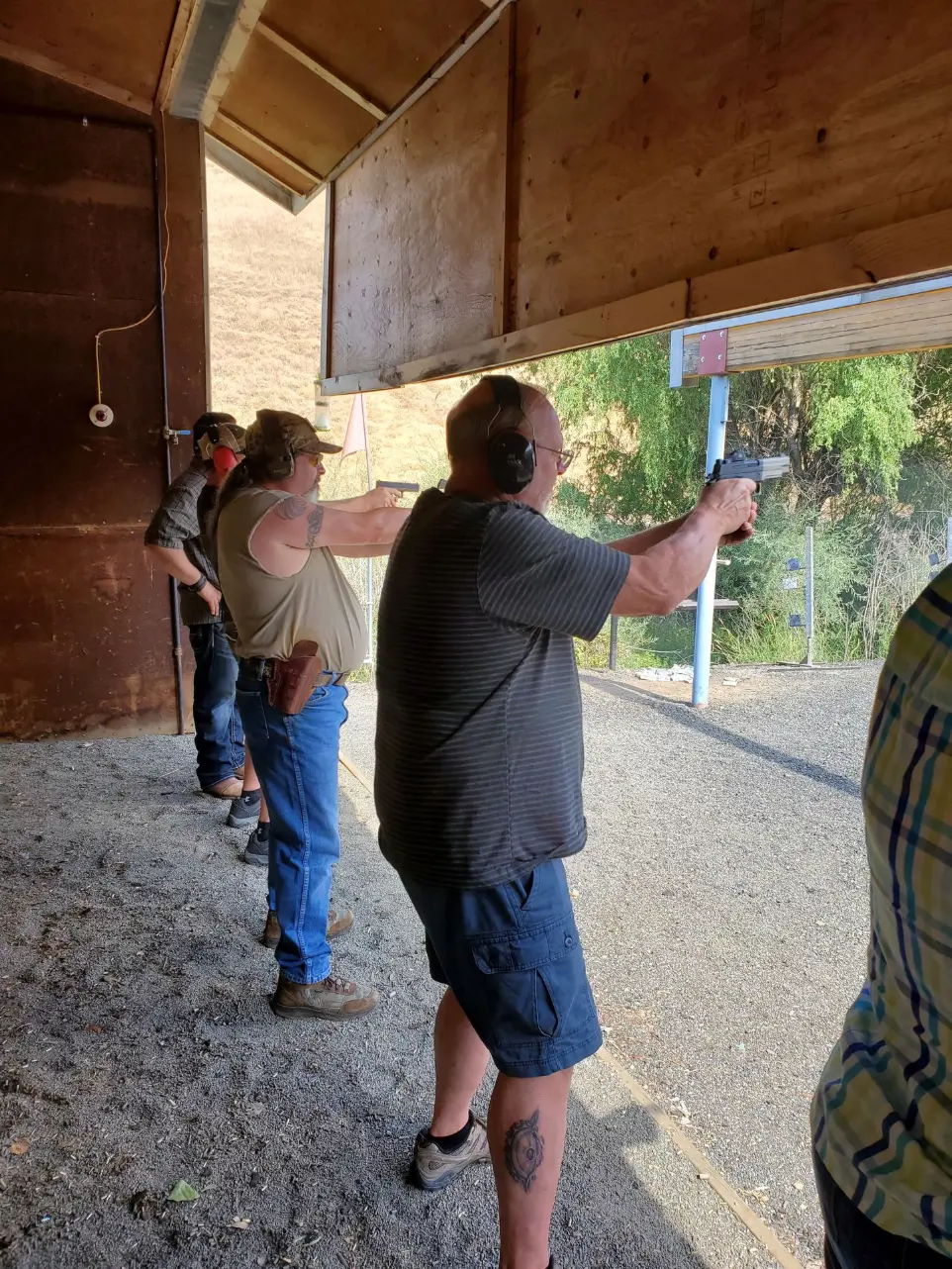 Men shooting in the range