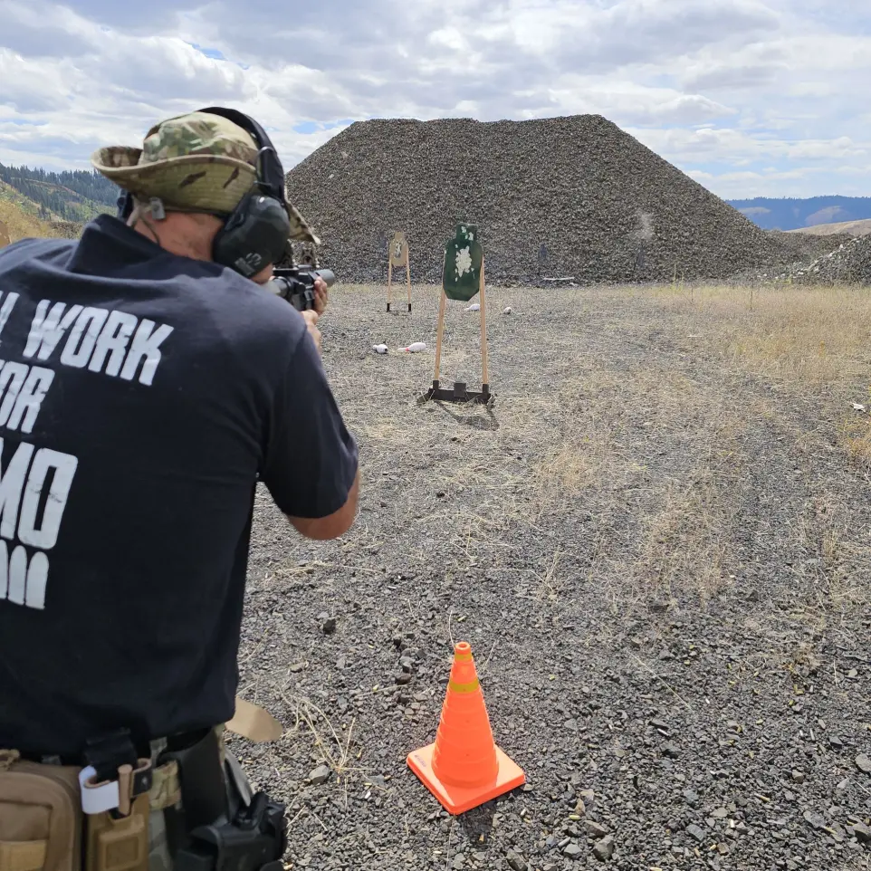 Instructor aiming firearm