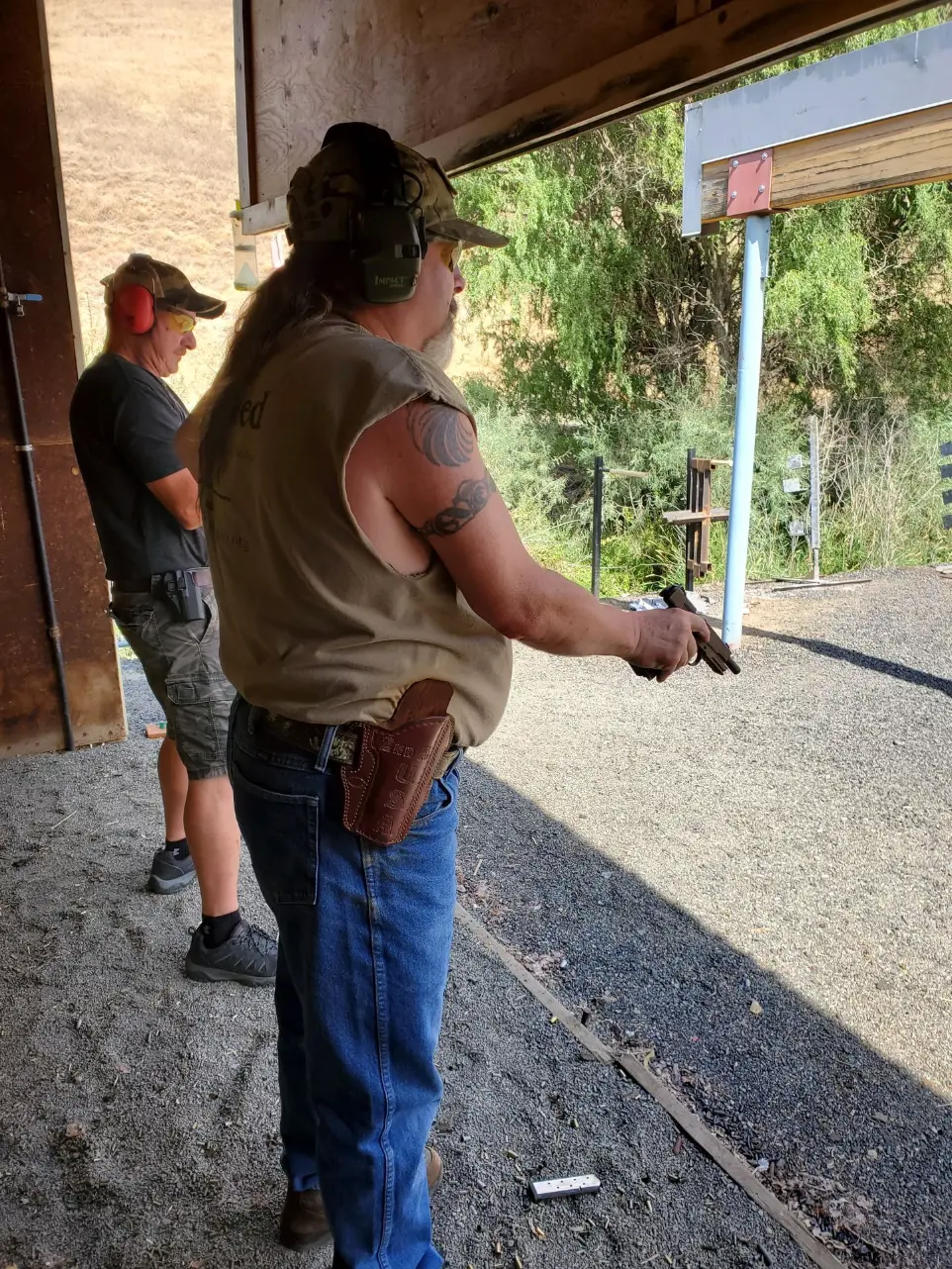 Man observing target on range