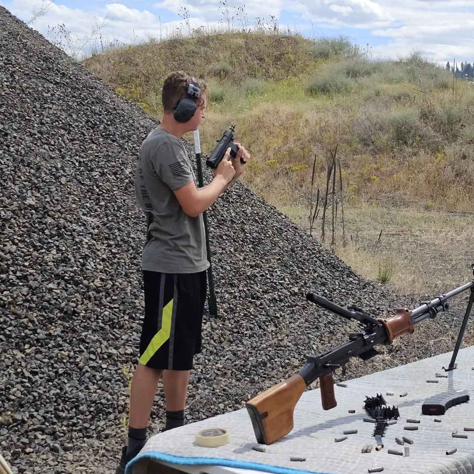 Man shooting rifle